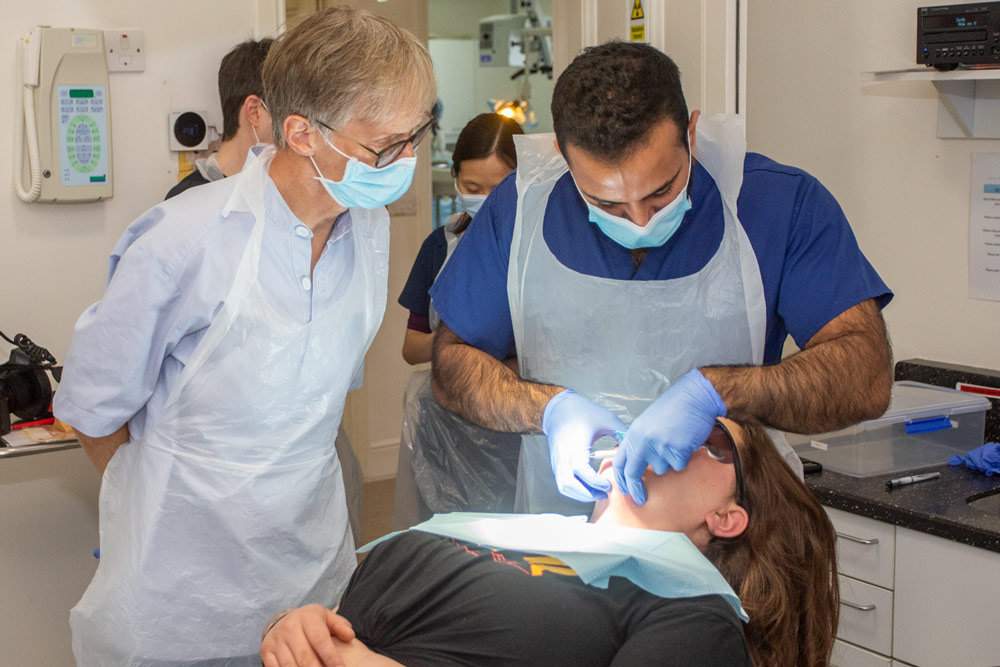 Jonathan Schofield teaching an MSC student in dental implantology